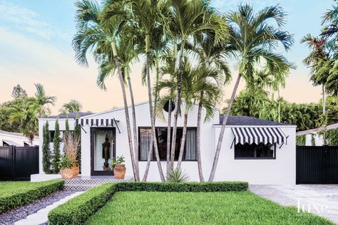 Complemented by classic Florida greenery, a midcentury bungalow meets global maximalism in Miami. Miami Bungalow, The Last Flight, Spanish Floor Tile, Florida Bungalow, Ipe Wood Deck, Mid Century Modern Lamps, Miami International Airport, Ipe Wood, Airport Lounge