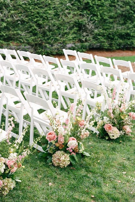 That aisle floral setup feels elegant for your ceremony. Our editors picked this to transform your wedding day decor. Pin this to your ceremony board. Ceremony End Of Aisle Decor, Aisle Way Wedding, Flowers Lining Aisle, Simple Wedding Arch Outdoors, Flowers Down The Aisle Wedding, Outdoor Wedding Aisle Decor, Wedding Isles Decoration, Outdoor Wedding Aisle Ideas, Wedding Ceremony Aisle Decor