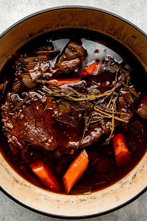 You don't need an expensive cut of beef to make a restaurant-worthy meal – this Red Wine Braised Beef recipe is proof! Slowly simmer beef chuck roast with red wine, vegetables, & herbs until it transforms into a succulent centerpiece complete with a built-in red wine sauce. Serve with creamy mashed potatoes for the best cozy dinner! (Slow cooker/Crockpot & Instant Pot directions provided.) #redwinebraisedbeef #redwinebeefroast #braisedbeef ##braisedbeefroast #beefroast #beefrecipes #dinnerideas Red Wine Beef Roast, Roast With Red Wine, Red Wine Braised Beef, Wine Braised Beef, Beef Braised, Braised Beef Recipes, Chuck Roast Recipes, Best Pot Roast, Slow Cooker Roast