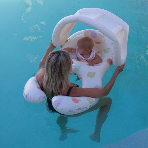 SWIMTIME BABY RANGE Let your little one in on the fun with the swim time baby range. The Apple Sorbet Float Together Baby Seat is made for the smallest members of the family with soft leg supports, an inflatable headrest, and a removable sunshade for sun protection. Plus it features a half ring so an adult can interact with the little one while it relaxes and floats in the water. Experience the best of summer with its adorable apple design and sweet pastel hues. Product Information Recommended w Bath Time For Babies, Cute Baby Things, Sorbet Float, Apple Sorbet, Baby Pool Floats, Baby Float, Soft Legs, Baby Pool, Baby Gadgets