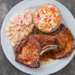 Kentucky-Style White Beans recipe: We use two smoky pork products (ham steak and smoked ham hock) to season creamy cannellini beans and then boost the smoky flavor even more with a touch of liquid smoke. Cooking the beans for 35 minutes helps create a slightly thickened, creamy texture. American Test Kitchen, Ham Steak, Cooks Country, Keto Pork Chops, White Bean Recipes, Bbq Pork Chops, Ham Steaks, Ham Hock, America's Test Kitchen Recipes