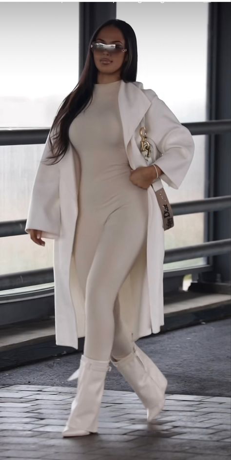 Lookbook Outfits Winter 2023, Winter Bougie Outfits, Hood Classy Outfits, White Winter Outfits Black Women, White Shark Boots Outfit, All White Baddie Outfit, White Jumpsuit Outfit Black Women, White Jumpsuit Black Women, Jumpsuit With Trench Coat