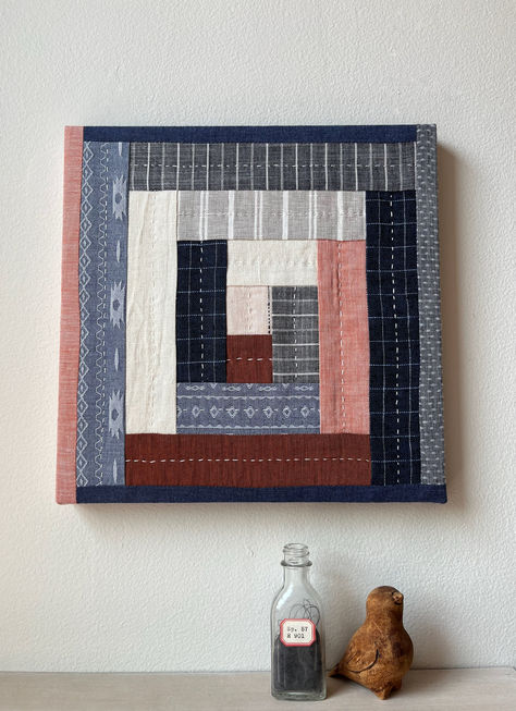 A linen and cotton patchwork square stretched on a wood frame in shades of blue, rust and salmon. Quilt Wall Art, Patchwork Art, Quilt Wall Hanging, Quilted Patchwork, Fiber Art Quilts, Quilt Wall, Quilt Square, Quilting Frames, Log Cabin Quilts