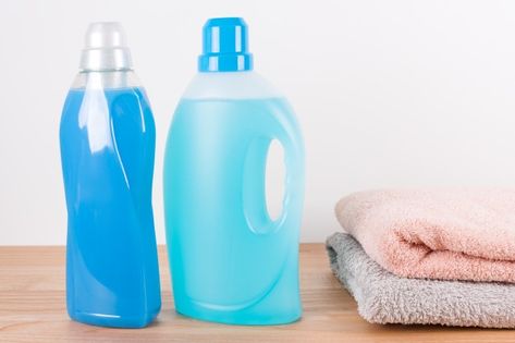 Bottles of detergent and fabric softener... | Premium Photo #Freepik #photo #wood #color #bottle #cleaning Clean Towels, Wooden Table, Wood Color, Fabric Softener, Wooden Tables, Premium Photo, Towels, Stock Photos, Wood