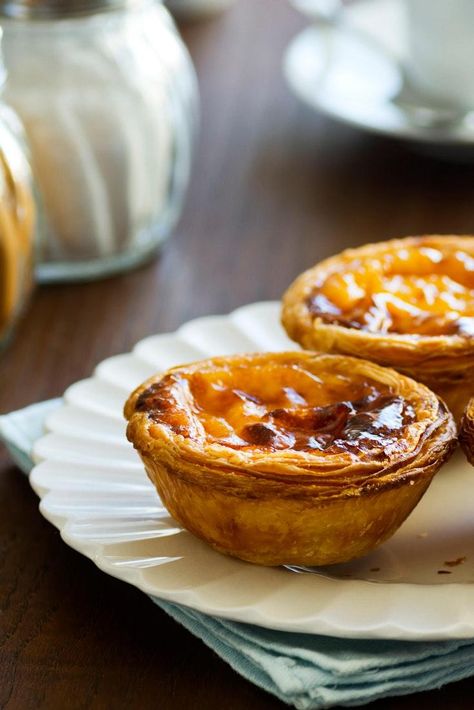 How the pastel de nata, a humble egg tart, became an icon of Portugal—and where to find the very best in Lisbon. Egg Tart Recipe, Custard Tarts Recipe, Portuguese Egg Tart, Portuguese Dishes, Beef And Potato Stew, French Mediterranean, Custard Tarts, Spanish Desserts, Cream Puff Recipe