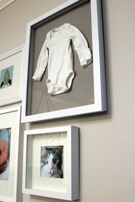 gallery wall with shadow box (first onesie, hat from hospital, etc.) and picture of family pet Displaying Newborn Photos, Nursery Gallery Wall, Family Pictures On Wall, Baby Shadow Box, Family Gallery Wall, Gallery Wall Nursery, Memory Wall, Wall Boxes, Photo Display