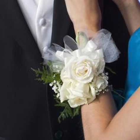 A wrist corsage with silk flowers will never fade or wilt. Diy Corsage Wristlet, Diy Wrist Corsage, Wristlet Corsage, Silk Flower Corsage, Bracelet Corsage, Wrist Corsage Wedding, Wrist Corsage Prom, Diy Corsage, Pearl Bracelet Wedding