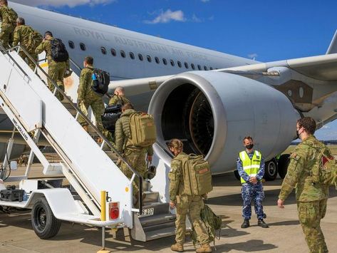 The first Australian-led rescue flight from Afghanistan has arrived at a military base in the United Arab Emirates after collecting 26 citizens and visa holders from Kabul. The RAAF C-130J Hercules aircraft landed at Hamid Karzai International Airport and departed safely about 1am local time. The evacuees were taken to a temporary holding centre for medical support and further screening. Foreign Service Officer, Australian Government, Australian Defence Force, Royal Australian Air Force, Children's Mask, Defence Force, Military Base, Military Personnel, Insurgent