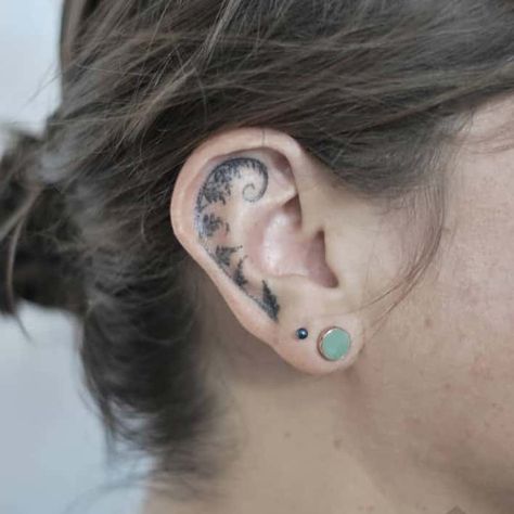 20+ Creative Ear Tattoos That Are Cooler Than Earrings Behind The Ear Tattoo Ideas Ocean, Octopus Ear Tattoo, Edgy Ear Tattoo, Upper Ear Tattoo, Nature Ear Tattoo, Behind Your Ear Tattoos, Elf Ear Tattoo, Unique Ear Tattoos, White Ink Ear Tattoo