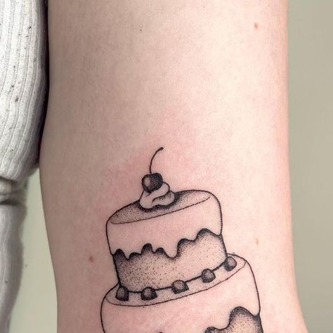 Sara Baenen on Instagram: "🎂🍰🧁CAKE🧁🍰🎂 • #cake #caketattoo #bakingtattoo #foodtattoo #desserttattoo #lineworktattoo #blackworktattoo #tattooideas #milwaukeetattoo #wisconsintattoo" Vintage Cake Tattoo, Cake Tattoo Ideas, Tara Tattoo, Dessert Tattoo, Baking Tattoo, Cake Tattoo, Frida Kahlo Tattoos, Bolu Cake, Food Tattoos