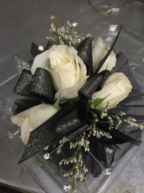 White Corsage With Black Ribbon, Corsage Prom Black And Gold, White Flower Black Ribbon Corsage, Black Corsage And Boutonniere Prom, Corsage To Go With Black Dress, Black And White Wrist Corsage, Black Corsages For Prom, Corsage Prom Black And Silver, Prom Wrist Corsage Ideas Black Dress