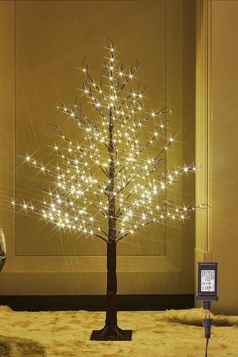 Illuminate your space with the LITBLOOM Lighted Brown Tree! 🌳✨ This 4FT twig tree with 430 LED fairy lights creates a magical atmosphere. Plug it in and let the warm glow add a touch of enchantment to your surroundings. Perfect for home decor, the soft lights bring a cozy ambiance. Elevate your space with the charm of this uniquely beautiful lighted brown tree! 🌟🌿 #LightedBrownTree #FairyLights #EnchantingDecor Lighted Tree Branches, Victorian Ball, Tree With Lights, Brown Tree, Prelit Tree, Twig Tree, Led Tree, Ball Party, Bare Tree