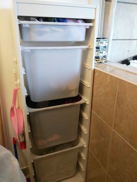 Laundry storage, divided laundry basket, small space  Ikea TROFAST with 4 boxes: - Special care - Baby - Blacks \ colors - whites Trofast Laundry, Divided Laundry Basket, Trofast Ikea, Ikea Trofast, Laundry Room Cabinets, Storage House, Creative Storage, Laundry Storage, Bathroom Cabinet