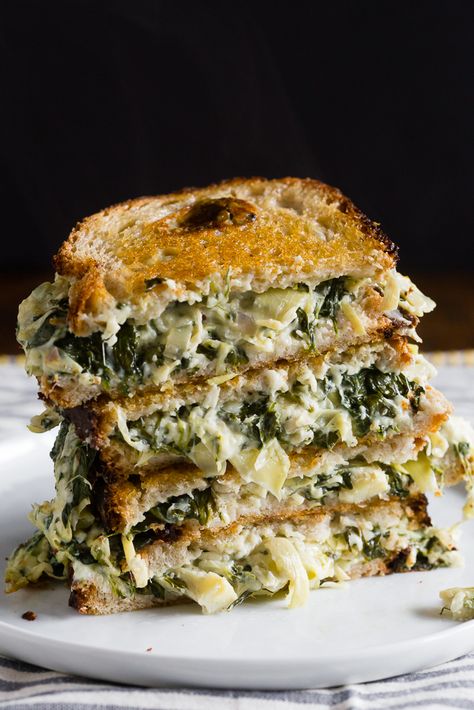 Spinach & Artichoke Grilled Cheese recipe - Inspired by the classic dip, with spinach, artichoke hearts, and three cheeses. The ultimate adult grilled cheese! Artichoke Grilled Cheese, Artichoke Grilled, Grilled Cheese Recipe, Artichoke Recipes, Grilled Cheese Recipes, Spinach And Cheese, Spinach Artichoke, Artichoke Hearts, Cheese Recipe