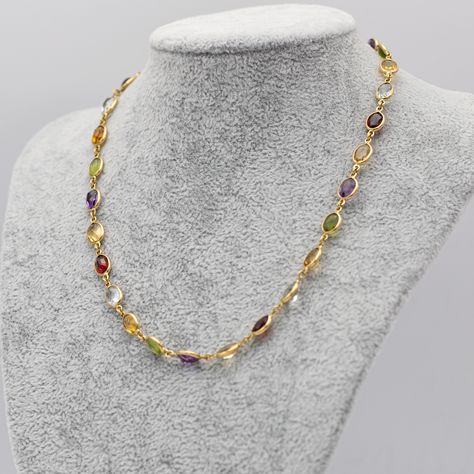 For sale is this marvellous multi coloured necklace. This chain is decorated with many oval shaped stones. These stones are no gemstones, yet they bring the perfect amount of sparkles and joy to this chain. It is hallmarked with a 750 and an Italian makers mark. We love this chain so much, it is the perfect chain to wear plain. But can as well be used as a charm carrying necklace. It is a versatile jewel that will steal your heart in no time. Necklace length : 41,5 cm - 16,34 Inch Total We... 22k Gold Multi-stone Necklace, Gold Artisan Multi-stone Necklace, Gold Artisan Multi-stone Necklaces, Gold-tone Polished Finish Chain Necklace, Vintage Multi-strand Gold-tone Chain Necklace, Multi Coloured Necklaces, Oval Shape, Makers Mark, Multi Color