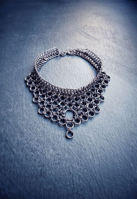 Hello! I made this Dark Goth Choker - Collar Necklace using strong & skin-friendly, hypoallergenic aluminum rings, with the ancient craft of chainmail. * This statement piece will look elegant & unique on your neck. (Be ready for curious questions ;) * It would be a perfect gift for a loved one, friend or a stylish family member 🎁 - Was made with European & Japanese chainmail patterns. - All the rings were attached to each other one by one by hand. HOW TO TAKE CARE OF YOUR ACCESSORY? * Anodized Collar Necklaces, Jewelry Chains, Chainmail Jewelry Patterns, Chainmail Accessories, Chainmail Choker, Chainmail Ring, Baby Girl Jewelry, Chainmaille Jewelry Patterns, Chain Maille Patterns