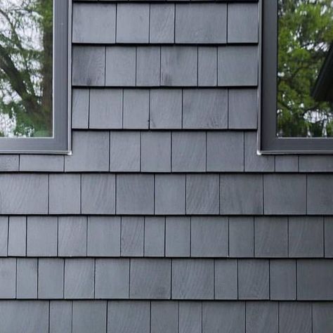 Buchner Manufacturing on Instagram: "Black is a classic exterior colour choice but pairing it with all black trims gives it a super modern look. We're loving @lemontree_interiors 's house! She used Fraser Wood Siding's Cedar Shingles in the colour Iron Ore. Check out her Instagram and when you're ready to make your house look as amazing as hers, visit your local Buchner Manufacturing to order your Fraser Siding! 🖤🏡 . @frasersiding 🖤 . . . . . . #home #architecture #cedarshakes #woodsiding #cu Black Vinyl Shake Siding, Black Shingle Siding, Black Shingle House, Painted Shingle Siding, Black Shake Siding Exterior, Black Shaker Siding Exterior, Black Shake Siding, Black Cedar Shake Siding, Painted Cedar Shake Siding