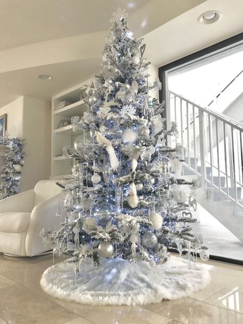 100 White Christmas Decor Ideas Which are Effortlessly Elegant & Luxurious - Hike n Dip White And Light Blue Christmas Tree, All Silver Christmas Tree, White Silver And Blue Christmas Tree, Modern Blue Christmas Tree, Silver And Light Blue Christmas Tree, White Christmas Tree Blue Lights, White Christmas Tree With Blue Decor, White Christmas Tree Blue Decorations, Blue And White Christmas Tree Ideas