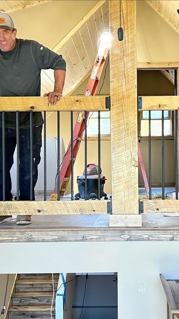 Erik Perkins on Instagram: "Watch how we built this cool railing out of rebar and Timbers #rustic #loghome #railing #rebar #woodworking #building #construction" Rebar Railing Stairs, Rustic Loft Railing, Diy Rebar Railing, Deck Railing With Rebar, Rebar Railing Porch, Rebar Stair Railing, Loft Stair Railing Ideas, Loft Railing Ideas Rustic, Rustic Stair Railing Ideas