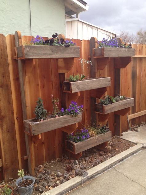 Fence Herb Garden - made from old redwood deck Herbs On Fence, Fence Planters Ideas, Fence Herb Garden, Herb Planters Outdoor, Hanging Herb Gardens, Redwood Deck, Outdoor Deck Decorating, Garden Tricks, Vertikal Garden