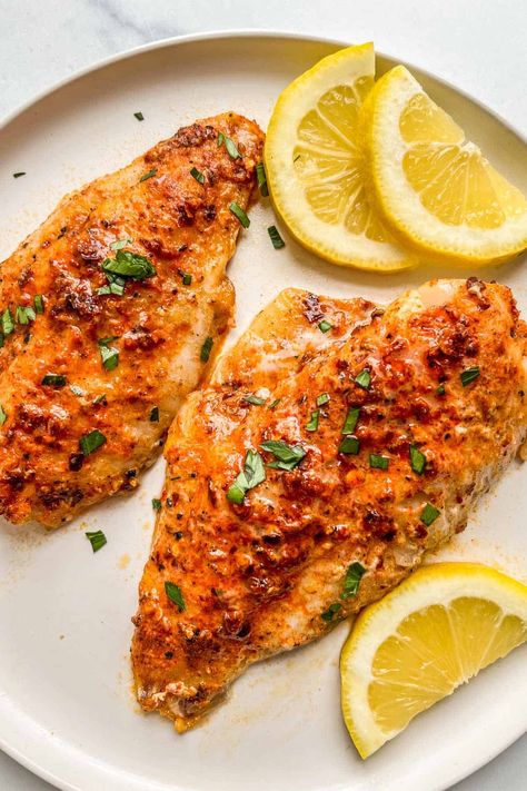 Two pieces of baked perch with lemon slices on a white plate. Recipes For Bass Fish, Perch Fillets Recipes, Healthy Perch Fish Recipes, Ocean Perch Recipes Baked, Perch Dinner Recipes, Baked Fish Fillet Recipe, Air Fry Perch Fish Recipes, Ocean Perch Fillet Recipes Air Fryer, Cooking Perch Fillets