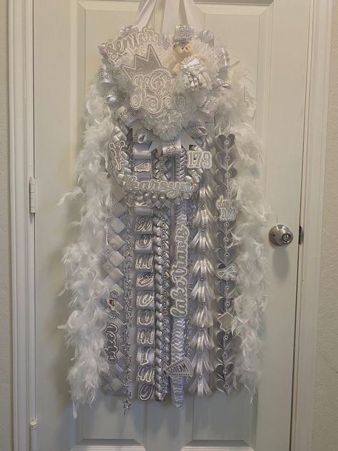 homecoming mum
senior hoco
senior mum
senior homecoming mum Lilac Mums Homecoming, White And Silver Senior Mum, White Senior Homecoming Mums, Silver And White Mums, White And Silver Homecoming Mum, Mum Ideas Homecoming Senior, Heart Shaped Homecoming Mums, Heart Shaped Mums Homecoming, Mum Inspo Homecoming