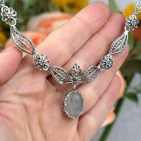 ✨ Adorn your neckline with the mystique of the moon! Our Gray Moonstone Sterling Silver Pendant is not just a piece of jewelry—it's a wearable piece of fine art. Dainty filigree work encases the enchanting gem, creating a masterpiece fit for a princess. Whether you're treating yourself or searching for a captivating gift, this charm is a treasure to cherish. ✨ Dive into the world of elegance: 👉 [https://nuel.ink/ztQ0iR #MoonstoneMagic #ElegantJewelry #GiftHer #GemstoneGlow #SilverSophistica... Grey Moonstone, Princess Necklace, Filigree Necklaces, Sterling Silver Filigree, Paisley Design, Girls Necklaces, Silver Filigree, Elegant Jewelry, Mother Earth