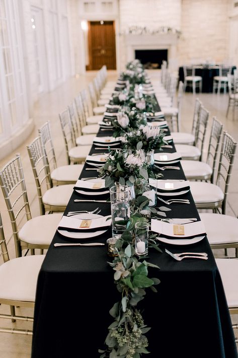 Black Green Tablescape, Black Long Tables Wedding, Table Decor With Black Tablecloth, Black Rehearsal Dinner Decor, Eucalyptus And Black Table Decor, Table Setting Black Tablecloth, Black Tablecloth With Greenery, White And Black Dinner Party, Black White And Green Table Setting