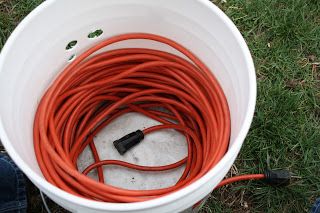 The Redeemed Gardener: "Cord in a Bucket" How to Store Extension Cords Store Extension Cords, Garage Hacks, Garage Organizing, Carport Ideas, Bucket Ideas, Garage Tool Organization, Shed Organization, Garage Organization Diy, Extension Cords