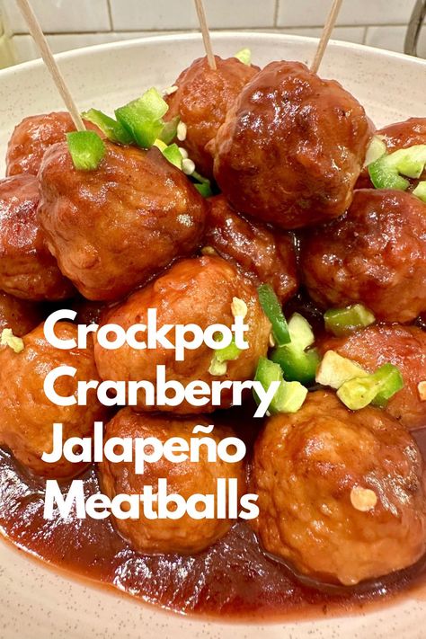 Meatballs coated with cranberry sauce in a bowl with tooth picks and topped with chopped peppers. Jalapeno Meatballs Crockpot, Cranberry Jalapeño Chicken Meatballs, Cranberry Meatball Sauce, Cranberry Jalepeno Chicken Meatball, Sauce For Cranberry Jalapeno Meatballs, Cranberry Jalapeno Chicken Meatballs Costco Recipes, Amylu Cranberry Jalapeño Meatballs, Cranberry Jalapeño Meatballs, Cranberry Jalapeno Meatballs Costco