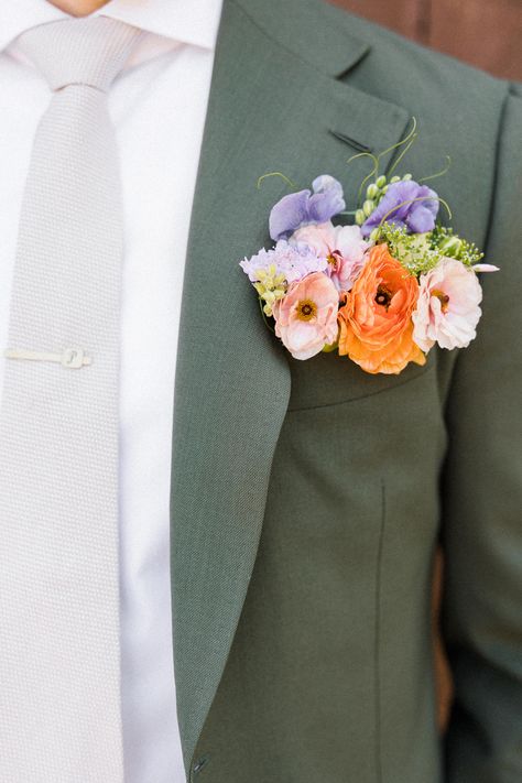 This is why you should try a pocket boutonniere instead of a traditional pinned boutonniere. Kaitie Brainerd Photography, Sacred Mountain Julian Wedding, orange boutonniere, boho boutonniere, boho wedding inspiration, modern wedding, wedding details, wedding inspo, colorful wedding, groom suit inspo Colorful Groom Boutonniere, Funky Boutonniere, Colorful Spring Boutonnieres, Wild Flower Wedding Boutonniere, Wildflower Wedding Groom, Wildflower Groomsmen Attire, Spring Wedding Suit, Multicolor Boutonniere, Colorful Pocket Boutonniere