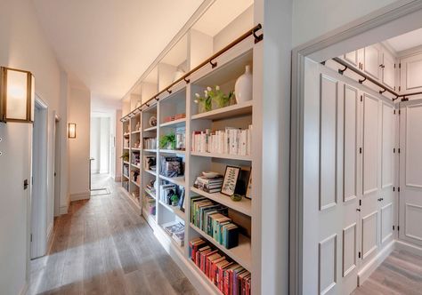 31 Wonderful Hallway Ideas to Revitalize Your Home | Home Remodeling Contractors | Sebring Design Build Corridor Storage Ideas, Entryway Cabinet Ideas, Library Aesthetic Home, Fireplace Millwork, Decorating Long Hallway, Cozy Home Library Ideas, Wall Millwork, Home Library Aesthetic, Long Narrow Rooms