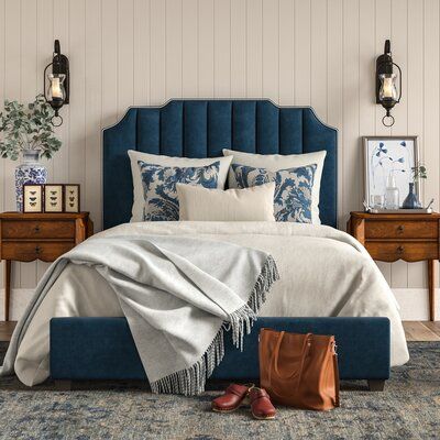 This bed is the right amount of dressed-up for a traditional southern home. With a classic look and clean lines with a ribbed headboard and classic silver nailhead trim. Think about adding a patterned duvet to really tie the look together. This bed also comes with two center legs that add that extra bit of support. Something to remember: Size: Full, Color: Navy | House of Hampton® Musgrave Upholstered Standard Bed Velvet in White / Blue, Size 55.0 H x 58.0 W x 82.5 D in | Wayfair Blue Upholstered Bed, Blue Velvet Headboard, Traditional Southern Home, Blue Headboard, Patterned Duvet, Standard Bed, Upholstered Panel Bed, Upholstered Panels, Bedroom Headboard