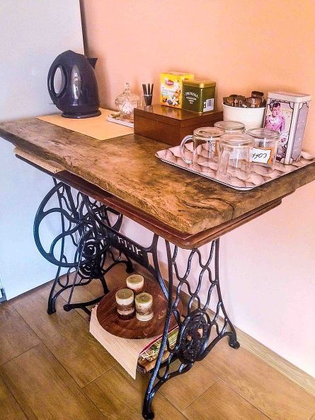 another way to use the old sewing machine, home decor, repurposing upcycling, Tea and coffee bar Sewing Machine Repurposed, Old Sewing Machine Table, Sewing Table Repurpose, Upcycled Furniture Before And After, Old Sewing Machine, Repurposed Decor, Sewing Machine Cabinet, Sewing Machine Table, Home Coffee Stations