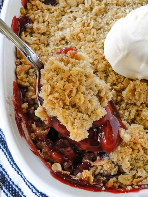 This Cherry Crisp Recipe is a quick and easy dessert made with pie filling and a crunchy oat topping. Top it with a scoop of ice cream or whipped cream and it's heavenly! Cherry Crisp With Pie Filling, Cherry Crisp Recipe, Cherry Crisp, Scoop Of Ice Cream, Blueberry Crisp, Cherry Ice Cream, Old Fashion Oats, Crisp Recipe, Cherry Pie Filling