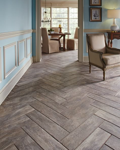 A real wood look without the wood worry.  Wood plank tiles make the perfect alternative for wood floors.  Create interest by laying your tile in a timeless herringbone pattern, giving your space elegant design presence with an even bigger wow. Wood Plank Tile, Plank Tiles, Wood Tile Floors, Casa Vintage, Enchanted Home, Wood Look Tile, Basement Flooring, Wooden Floors, Floor Ideas