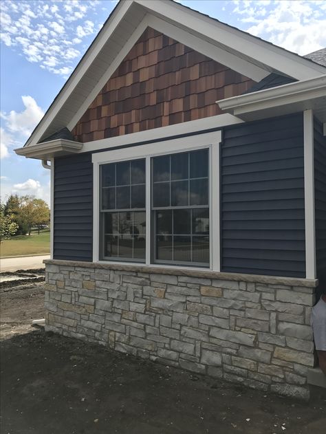 Marine navy and cedar shake!!❤️❤️❤️ Navy Blue Outside House Paint, Blue House With Cedar Shakes, Blue Wood Siding Exterior, Navy Blue Vertical Siding, Navy Blue Siding With Brick, Shaker Siding In Peaks, Cedar Shake And Stone House, Cape Cod Cedar Shake, Pacific Blue Siding House Exterior