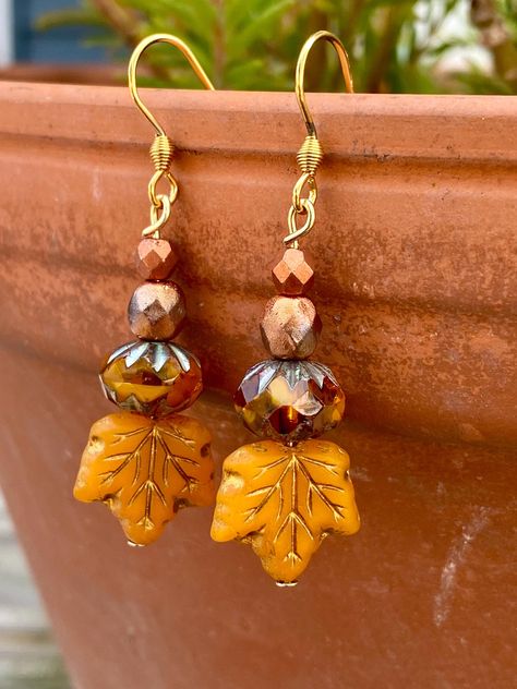 Lovely Czech Glass Beaded Fall Earrings! 🍂 Length is 1.75 inches long. Dainty!  Beautiful orange, gold, and burnt Carmel coloring!  Stainless steel gold tone earring wires.   Earrings come with a pretty earring card.  Happy fall! Fall Earrings Beaded, Diy Fall Earrings, Diy Fall Jewelry, Czech Beads Jewelry, Pretty Earring, Whimsical Earrings, Fall Bead, Autumn Jewelry, Jewelry Making Earrings