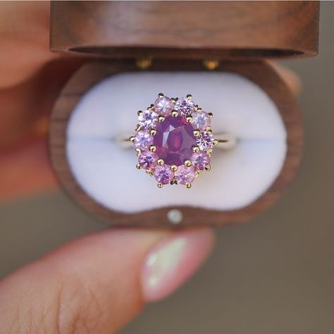 Introducing our new Purple Sapphire Cluster Ring 💕 This ring has a cushion cut light purple sapphire center stone and ten opalescent pink/purple sapphires, making it a truly one of a kind ring. We’re obsessed with the opaque sparkle of the sapphires in this ring. It’s the perfect vintage look, with a colorful twist. Comment below if this is your dream ring ☺️ Purple Sapphire Cluster Ring (Product ID: B0741) #uniqueengagementring #vintageinspiredengagementring #engagementrings #ringoftheday ... Berlinger Jewelry, Sapphire Cluster Ring, Champagne Diamond Rings, Purple Ring, Purple Rings, Purple Sapphire, Champagne Diamond, Dream Ring, Art Deco Jewelry