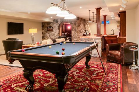 If you’re planning to have an area rug underneath your pool table, make sure it’s in place before your pool table arrives. Moving a pool table after it’s set up, even a little to put a rug underneath, will ruin the precision leveling of the table, and the table will require servicing afterward. Recreational Room Ideas, Rec Room Basement, Pool Table Room, Basement Gym, Modern Basement, Game Room Basement, Recreational Room, Game Room Family, Small Basements