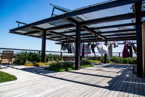 "The Commoners," residents go without personal laundries, using a row of six washing machines and a... Laundry Rooftop, Sustainable Apartment, Apartment Rooftop, Rooftop Apartment, Apartment Block, Micro Apartment, Rooftop Design, Building Images, Modern Pergola