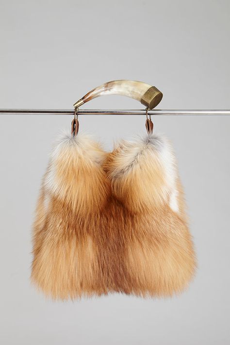 A real Argentine cow horn is used as a handle for this natural gold fox fur handbag. 15% off your first purchase! Free shipping over $100; 30-day returns. Order online today. Fur Handbag, Fox Bag, Gold Fox, Fur Handbags, Cow Horns, Fur Accessories, Fur Bag, Natural Gold, Fall Fits