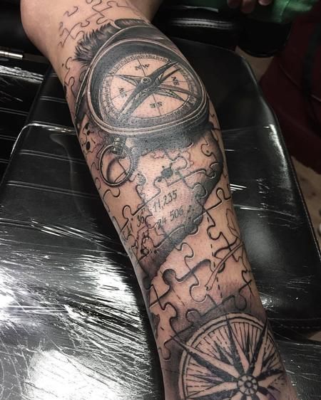 Yarda - Compass tattoo with a map and jigsaw puzzle Jigsaw Tattoo, Puzzle Tattoo, Voll Arm-tattoos, Portrait Tattoo Sleeve, Puzzle Piece Tattoo, Puzzle Tattoos, Map Tattoos, Men Tattoos Arm Sleeve, Flame Tattoos