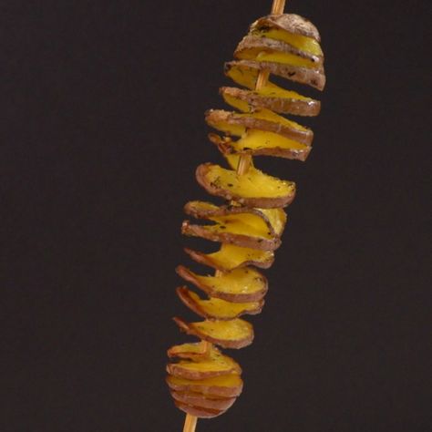 Skewer potato in tornado spiral on black background Air Fryer Potato Spirals, Fried Tornado Potato Recipe, Potato Tornado, Spiral Potatoes On A Stick, Tornado Potato Skewers, Parmesan Potato Stacks, Tornado Potato, Garlic Parmesan Fries, Parmesan Fries