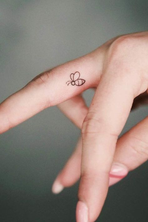 Cute Simple Bee Tattoo, Bee Related Tattoos, Mini Bee Tattoo Simple, Bee Tattoo Minimalist Cute, Tiny Bumble Bee Tattoo Simple, Bee Finger Tattoos For Women, Bee Tattoos Simple, Bumble Bee Tattoo Behind Ear, Honey Bee Finger Tattoo