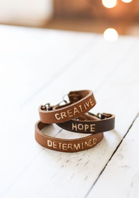 Easily make this personalized DIY leather word bracelet! It makes the perfect DIY gift idea! | Pretty Handy Girl | DIY jewlery | #prettyhandygirl #DIYjewelry #craft Diy Personalized Bracelets, Easy Leather Bracelet Diy, Leather Stamping Diy, Cricut Leather Bracelet, How To Stamp Leather Diy, Cricut Bracelet Ideas, Leather Bracelet Cricut, Diy Leather Bracelet Tutorial, Cricut Bracelet