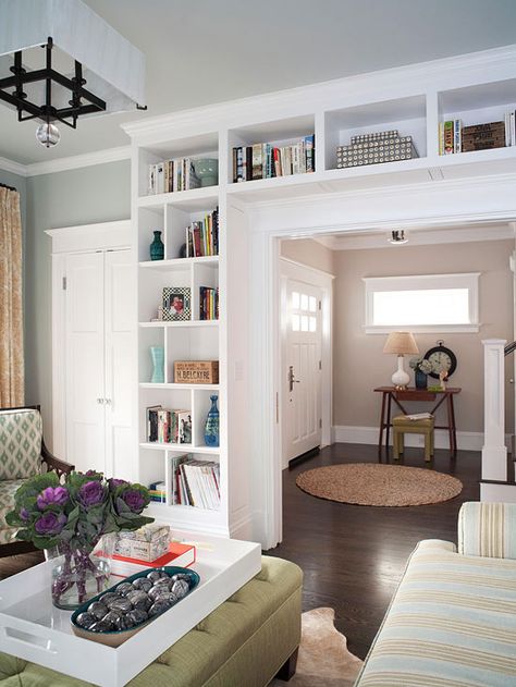 Large built-in shelves add character to this entryway. See the rest of this madeover home: http://www.bhg.com/home-improvement/remodeling/additions/family-friendly-home-makeover/?socsrc=bhgpin072012builtinshelveslivingroom#page=3 Organizing Small Home, Ikea Bookcase, Furnitur Ruang Keluarga, Bookcase Diy, Storage Furniture Living Room, Built In Bookcase, Built In Shelves, Living Room Storage, Style At Home