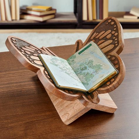 Hand carved of solid, sustainably harvested mango wood, the Butterfly Book Stand cradles a favorite tome for your perusal in its inviting, intricately patterned wings. Ideal for cookbooks, dictionaries, family Bibles or any book you wish to proudly display or read from often. Through the Levenger Partnering For Good program, a portion of the proceeds from this and every Tree of Knowledge product will help support the education system of low-income communities in India where this product is made. Butterfly Book, Tactical Wallet, Wood Butterfly, Butterfly Books, Bunny Painting, Kitchen Organisation, Book Stand, Cozy Room Decor, Book Stands