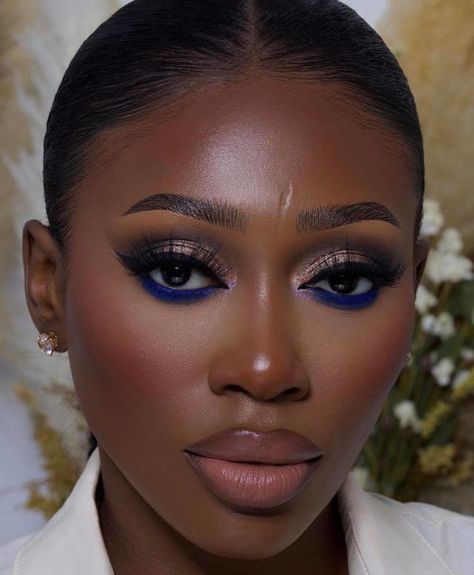 Color Eyeliner Black Women, Juvias Place Olori 1 Looks, Dark Skin Blue Makeup, Blue Eyeshadow Makeup Black Women, Dramatic Eye Makeup Black Women, Eyeshadow Looks On Black Women, Blue Eyeshadow Black Women, Simple Blue Eyeshadow Looks, Blue Under Eye Makeup