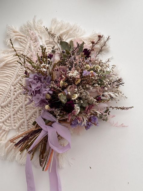 Oh this everlasting bouquet! Made for the brides this absolutely breathe-taking real preserved rose and daisy filled bouquet featuring lots of detailing. I have used a range of dried and preserved roses, tea tree, mini daisy, dried german statice, rice flowers, nigella, misty, mini gum,  wild flowers, and bunny tails. It is flat-backed for easy handling by brides. If you would like to have a fuller back please convo me first. This one is a medium size, and it's ready to ship.  Large bridal bouqu Dried Flowers Purple, Whimsical Flower Bouquet, Dark Wildflower Bouquet, Bridesmaid Flower Bouquets, Whimsical Flower Arrangements, Lavender Bouquet Wedding, Wild Flower Wedding Bouquet, Daisy Wedding Bouquet, German Statice